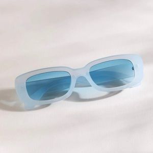 Baby blue plastic sunglasses